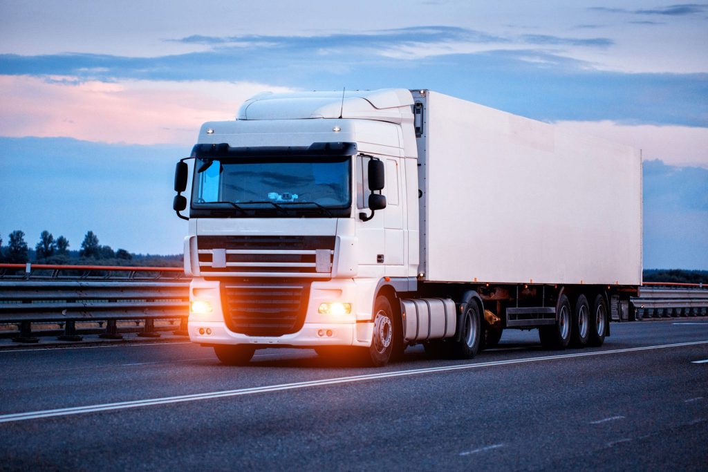 Refrigerated freight truck on the road.