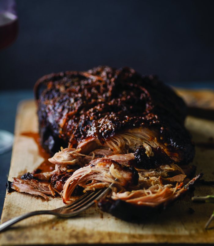 Pulled pork on a cutting board.